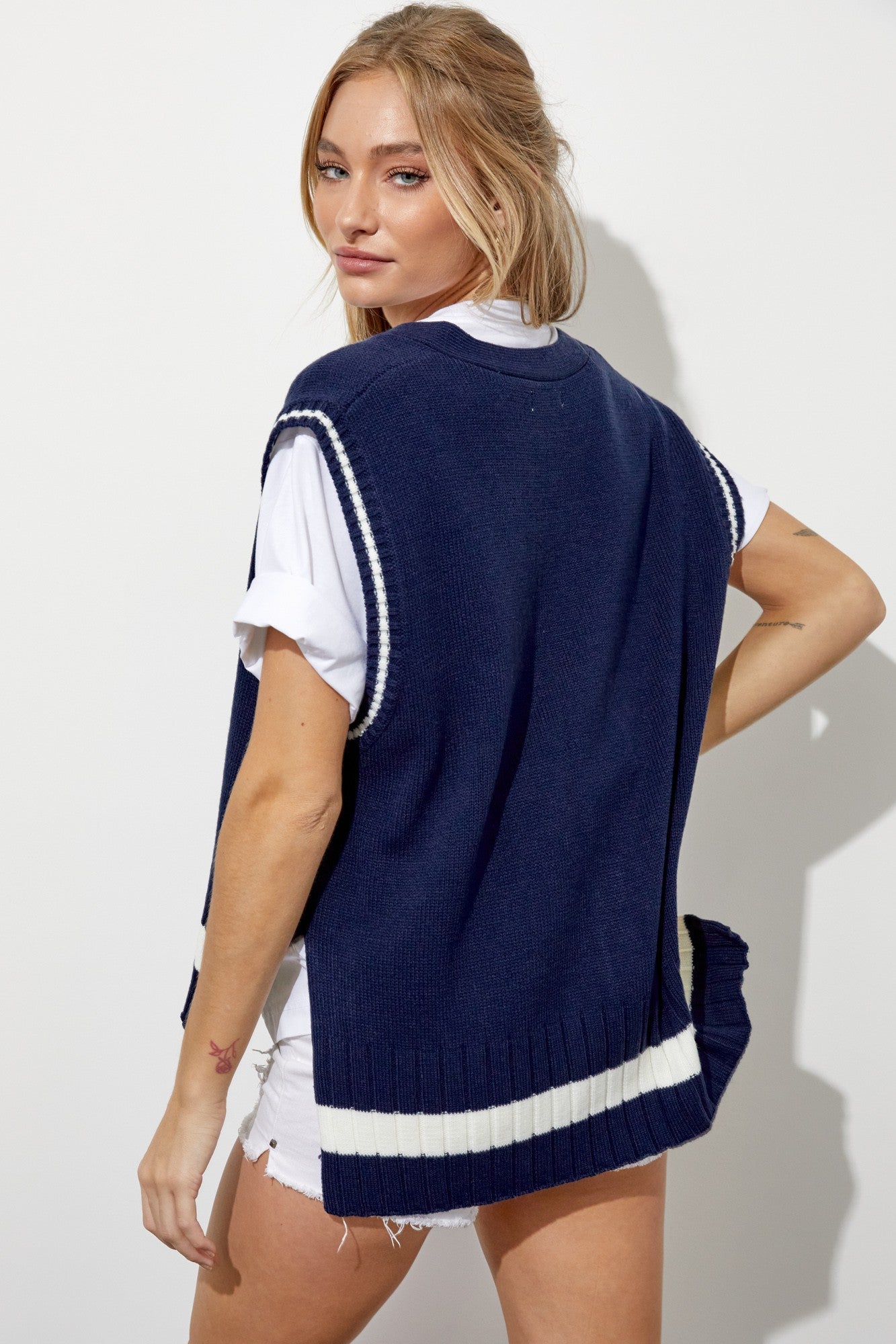 Women’s navy oversized vest with sleeveless design, offering comfort and chic style.