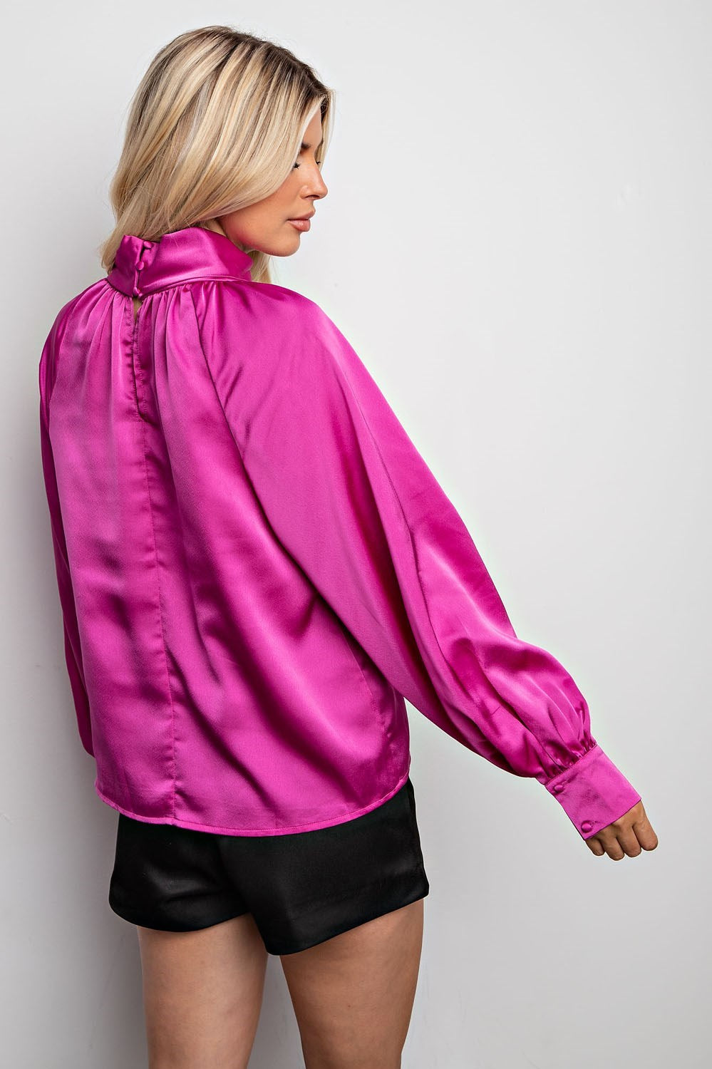 Magenta knotted collared blouse for women.