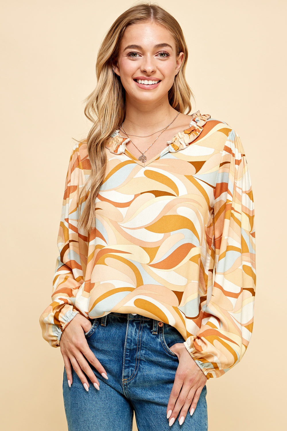 Mustard geometric print long sleeve blouse for women.