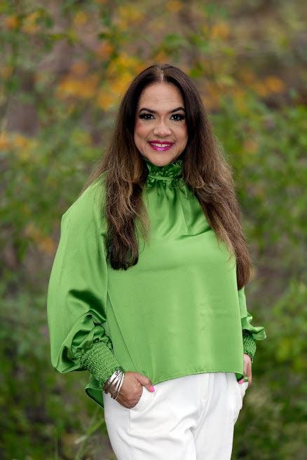 Women’s green high collar blouse with tie-back detail